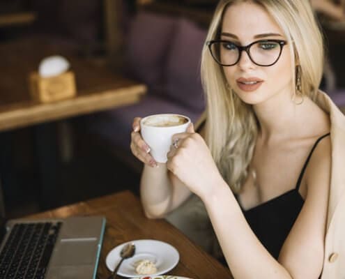 beautiful young woman holding coffee cup 23 2147871286